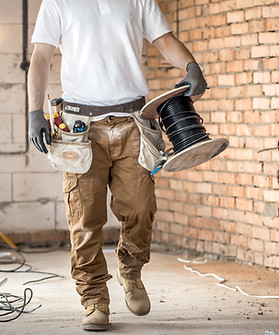 electrician-with-tools-working-construction-site-repair-handyman-concept.jpg
