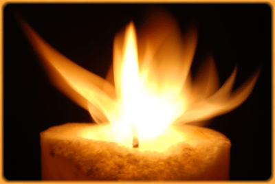 Candle with a sparkling flame