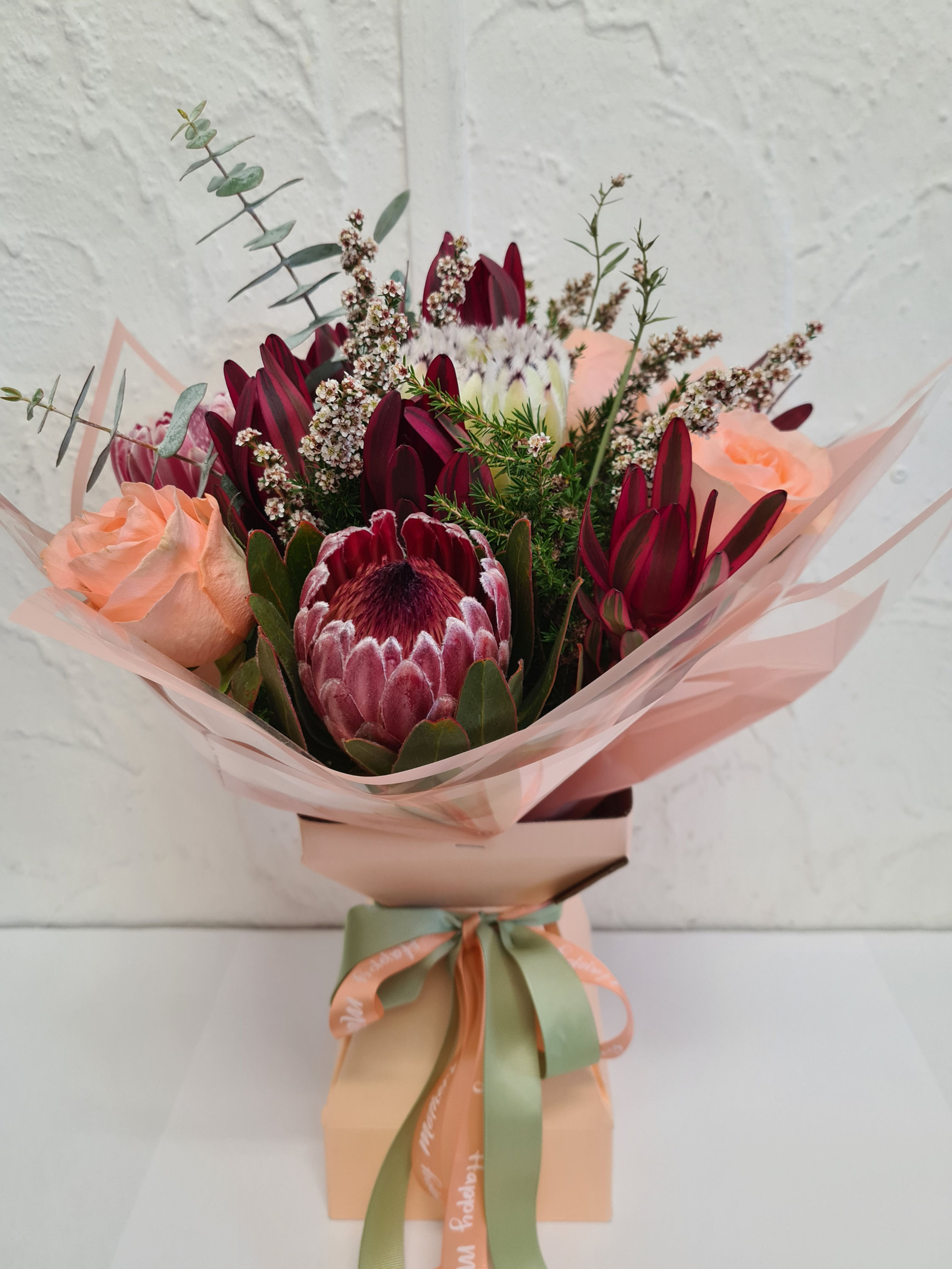 Wildflower seasonal flowers with roses in mod vase