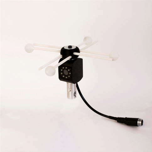 Black camera with white arms, and a black cable on a white background.