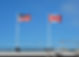 Flags flying at a US and Canadian border.jpg