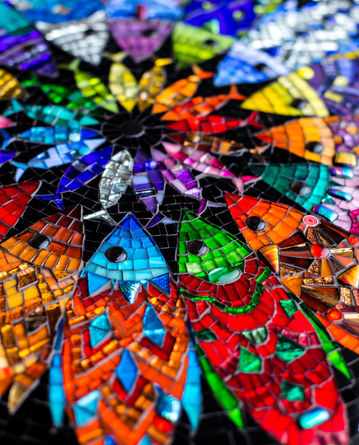 Colourful mosaic fish mandala art by julieedmundsmosaics