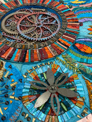 Vibrant mosaic artwork featuring gears and floral designs by julie edmunds mosaics