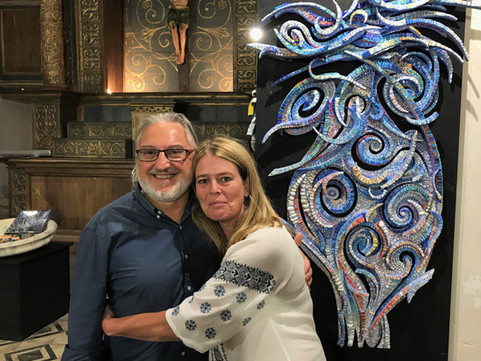 Two artists with Giulio Menossi's mosaic artwork