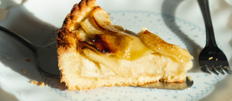 apple cake on a plate with a fork