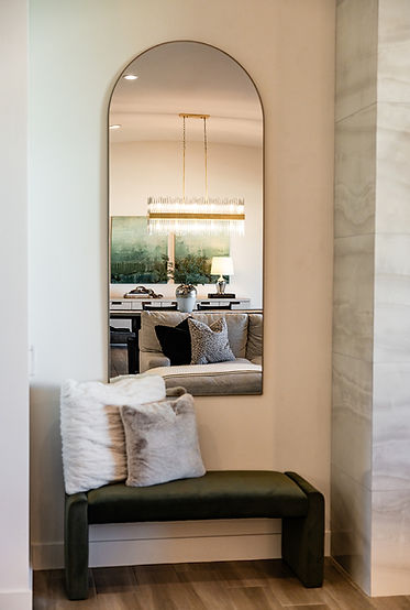 bench and wall mirror in living room