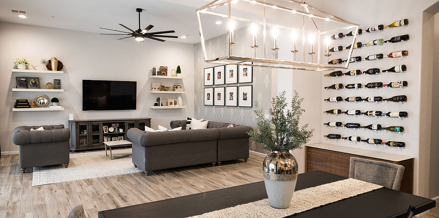 open concept living dining room with wine display wall, familly gallery wall and floating shelves