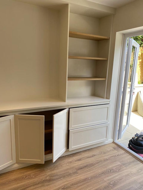 living room shelves and a cupboard