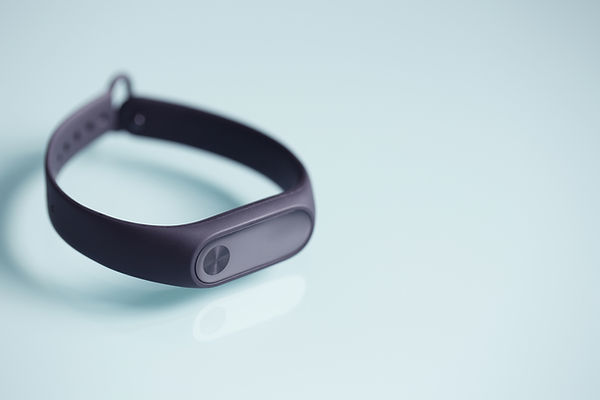Fitness tracker that is black in color and you would wear it around the wrist