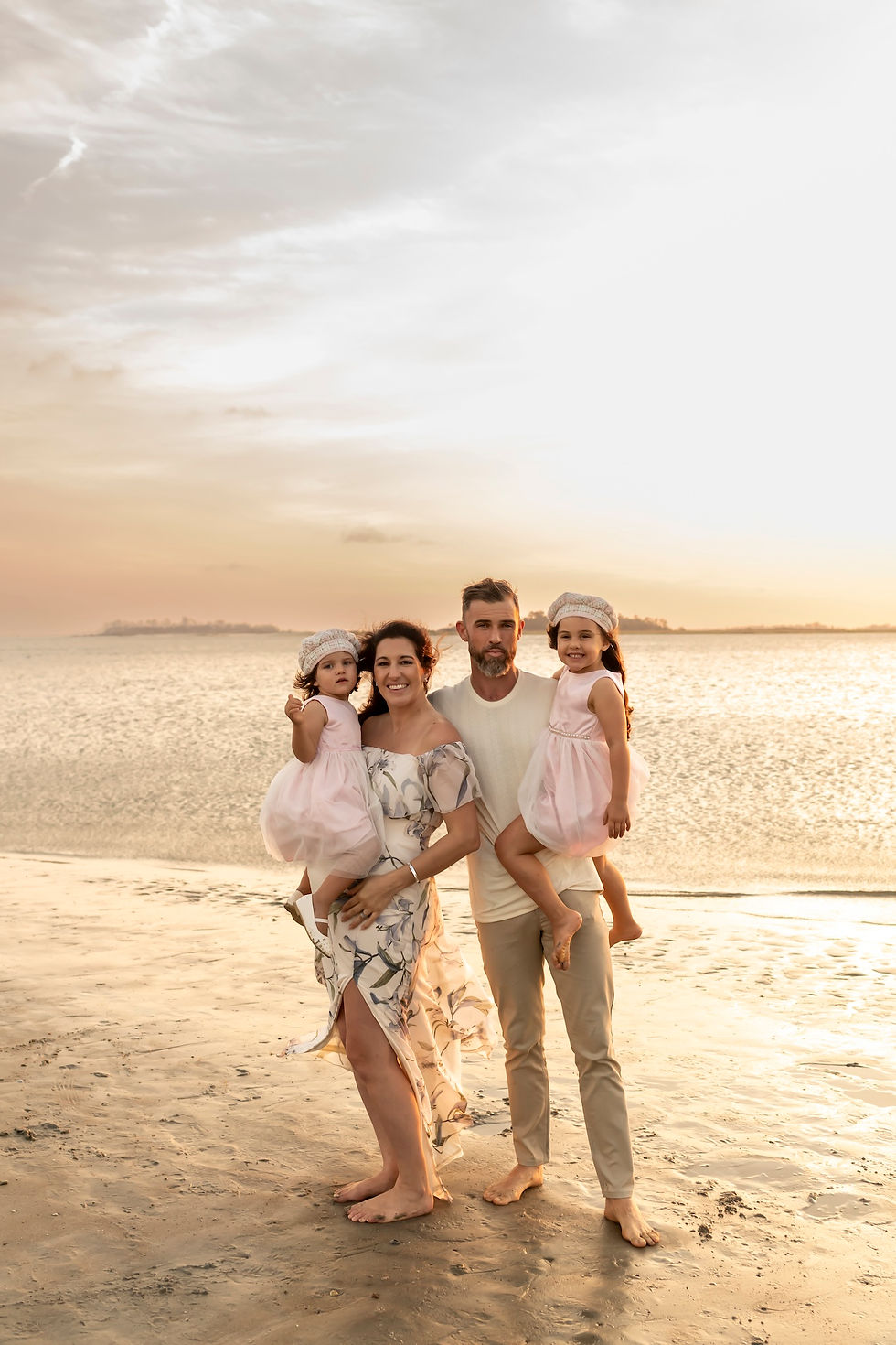 The Elwood family's family portraits on Tybee Island Beach in Savannah, Georgia.