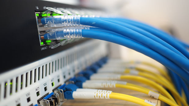 lan cable with fiber optic cable connected use for network product concept. closeup photo.