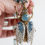 Thumbnail: Handcrafted necklace with a fantasy beetle pendant made of brass and silver, decorated with natural aquamarine gemstones and