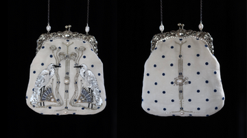 Embroidered purse with heron motifs, showcasing front and back views of the finished bag