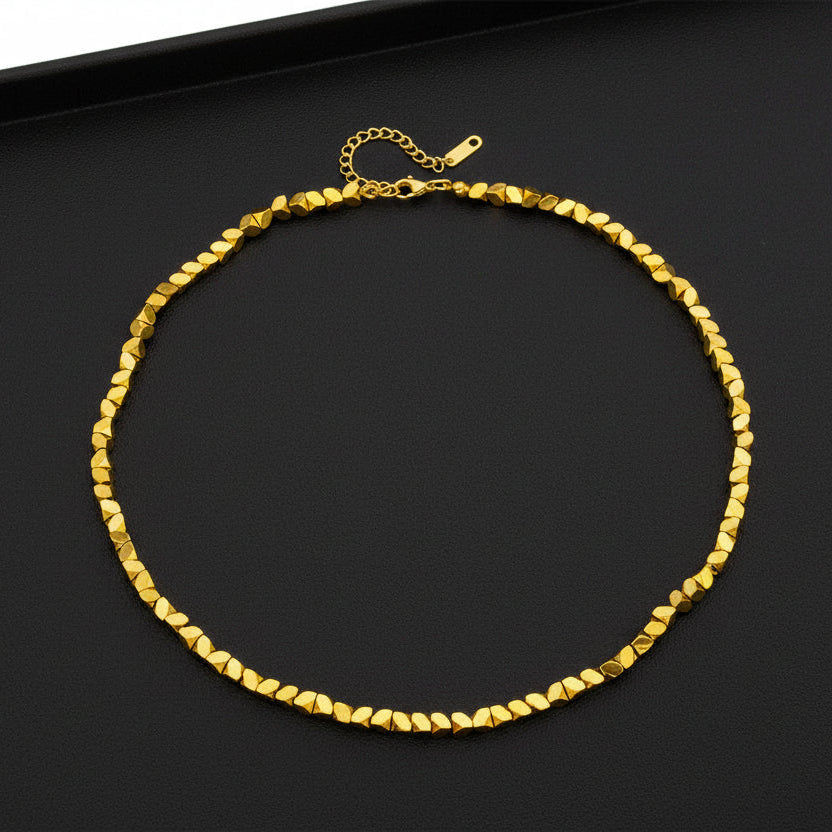 Gold necklace with measurements and weight information on a white background