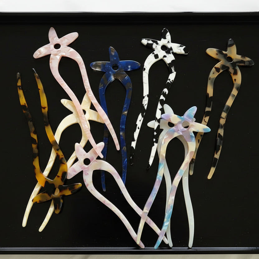 Collection of colorful hair accessories on a white background