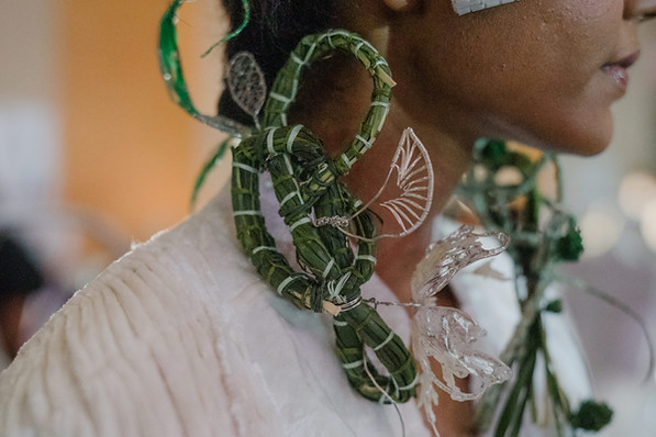 Statement floral necklace made of handwoven grasses, moss, recycled materials and handcrafted resin and rice grain motifs. A r
Designed for KHAAR, Vietnamese design brand, at the Singapore Fashion Council's fashion show. A collaboration reflecting the inspiration for KHAAR's collection.