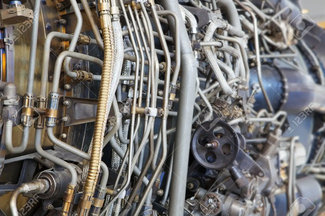 13849080-the-complicated-plumbing-of-tubing-inside-a-jet-engine.webp