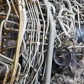 13849080-the-complicated-plumbing-of-tubing-inside-a-jet-engine.webp