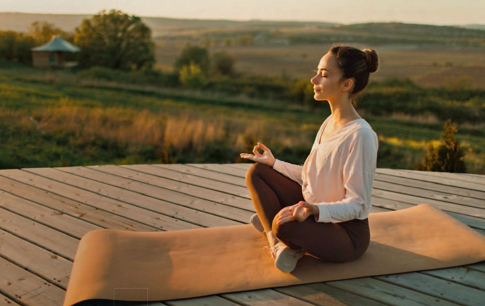 woman meditating outdoors in a peaceful setting, practicing mindfulness and relaxation techniques