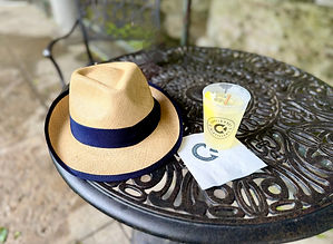 Fedoras and beverage at Castle & Key Distillery