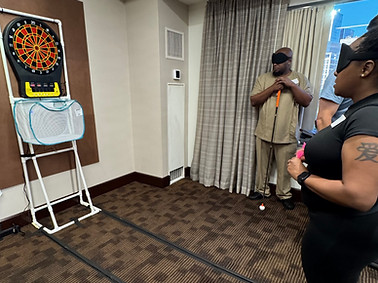 A player readying to take a shot at an electronic dartboard