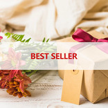 A captivating display featuring a gift wrapped in a box, accompanied by a beautiful flower bouquet on a rustic wooden table. A transparent strip adorns the setup, showcasing the words 'Best Seller.' Explore our Best Seller page and discover top-rated products that have captured the hearts of many, making them the most sought-after gifts for every occasion