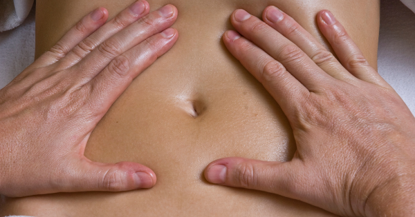 Professional therapeutic massage at EastWest Center Atitlan, a holistic wellness center by Lake Atitlán, Guatemala. Relax and renew your energy with personalized massage techniques to relieve stress and muscle pain. abdominal massage, masaje abdominal