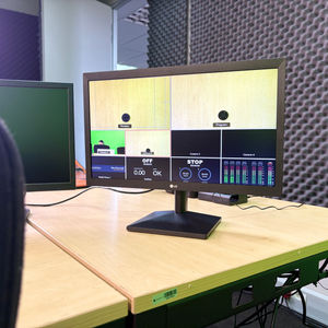 Dual Monitors on Wooden Desk in Studio
