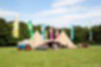 Wedding double tipi in field with tractor