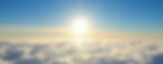 Panoramic image of the sun shining on the side above the clouds crisp blue skies
