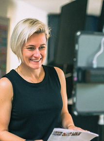 Eloise Rees, founder of Squeeze the Lemon Studios, directing on set during a brand video shoot.