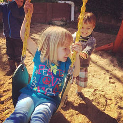 Pushing Audrey on the swing