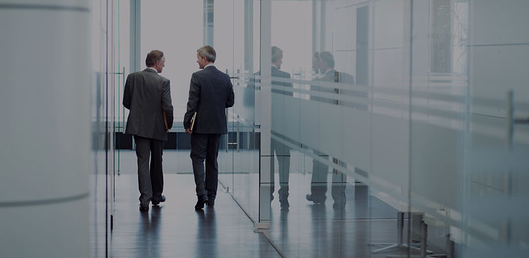 Business Meeting of Two Men Walking in the Hall_edited.jpg