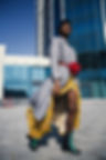 Black Woman Yellow Skirt with Red Purse
