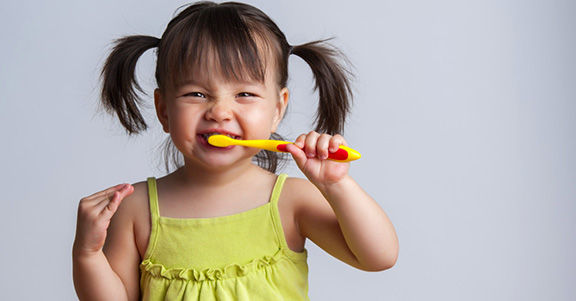 Girl Brushing Teeth