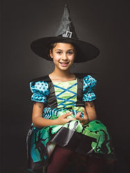 Girl dressed as a witch during a Halloween studio portrait session in London.