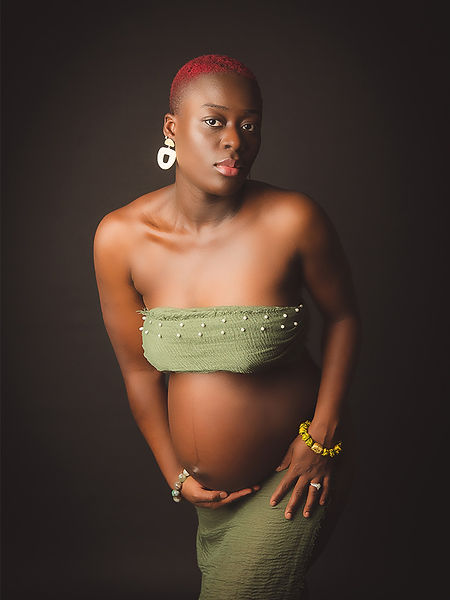 mother-posing-stylishly-with-her-belly-black-background-studio-pennypics-london-photography