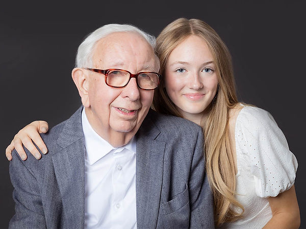 A grandparent and child photographed together in a London studio during a Pennypics family portrait session, with gentle connection and carefully shaped light.