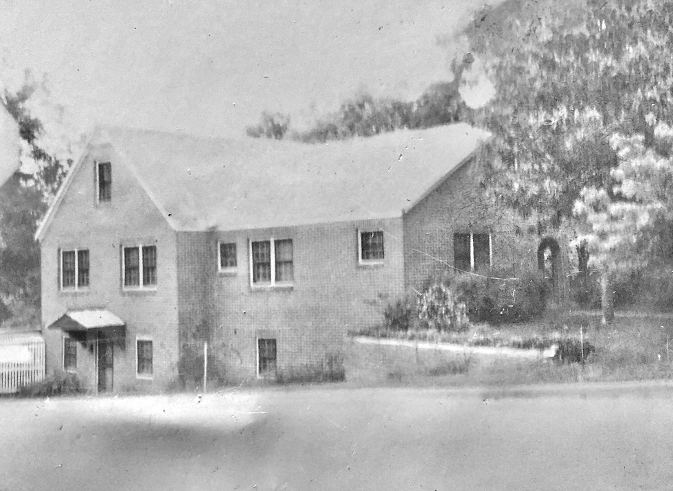Eye-level view of the Stroud House showcasing its historic architecture