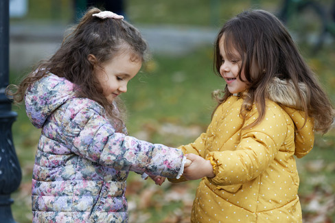 two girls playing outside