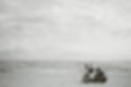 My girls search for beach treasures in the waves as their friends do the same in the foreground