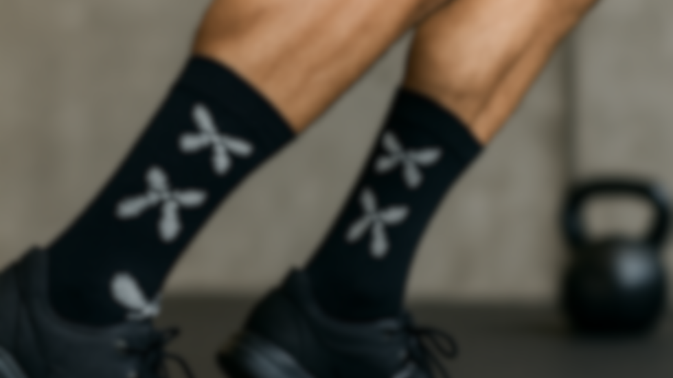 Man wearing Xtra Crazy Socks during World Down Syndrome Day while working out at the gym