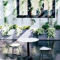 Cafe Tables (cast steel base with sheet-steel top) - $18/each, 3 available and Black Wire Café Chairs (choice of gray or lime green cushion) - $5/each, 12 available
