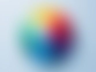 A vibrant color wheel placed neatly on a white surface, with evenly divided sections.