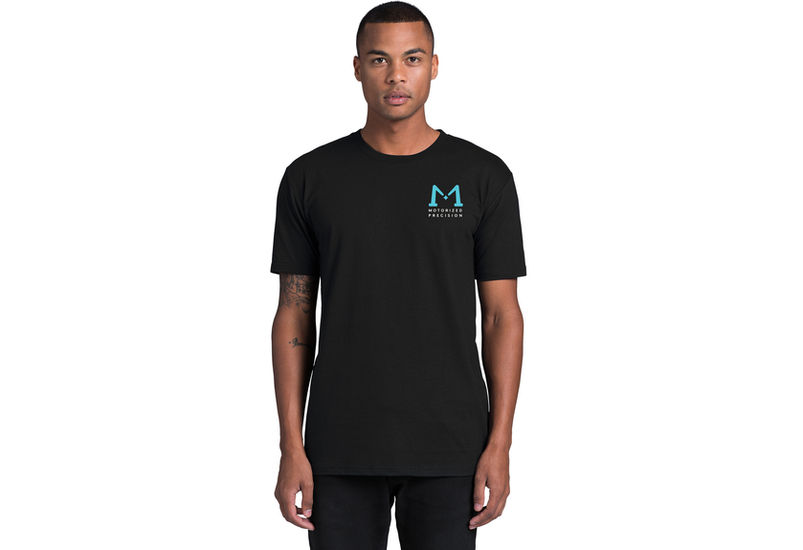 Model wearing black EVO Drip T-shirt showing front M chest logo and Motorized Precision text