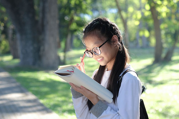 asian-girl-student-holding-pencil-and-standing-rea-2021-04-02-22-21-37-utc.jpg