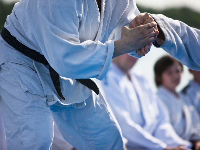 Two people practicing martial arts