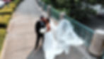 husband and wife kissing outside of the pennsylvanian on a walkway with bride's veil floating in the wind taken from a drone aerial perspective in pittburgh by luxury wedding videographer dorosh documentaries