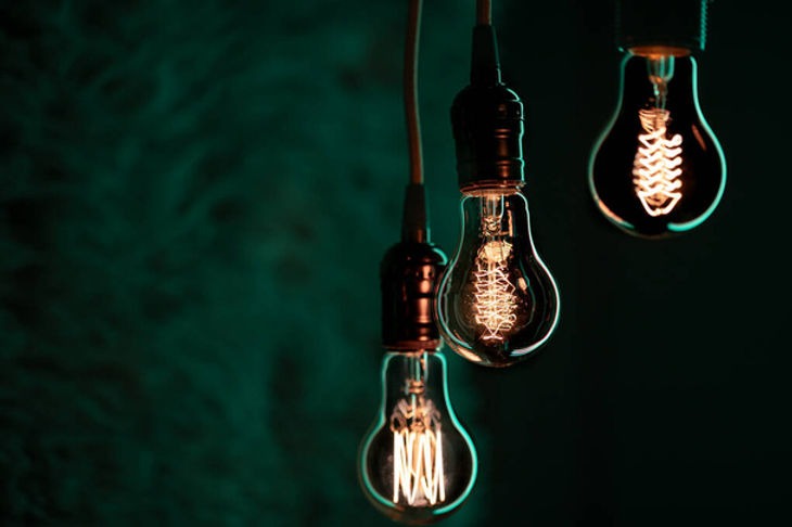 stock-photo-luminous-lamps-hang-dark-decor-atmosphere-concept.jpg