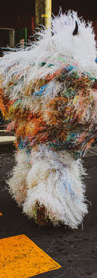 A person dancing in a traditional sensei costume